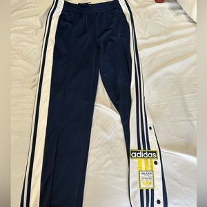 Navy blue adidas breakaway pants from urban outfitters